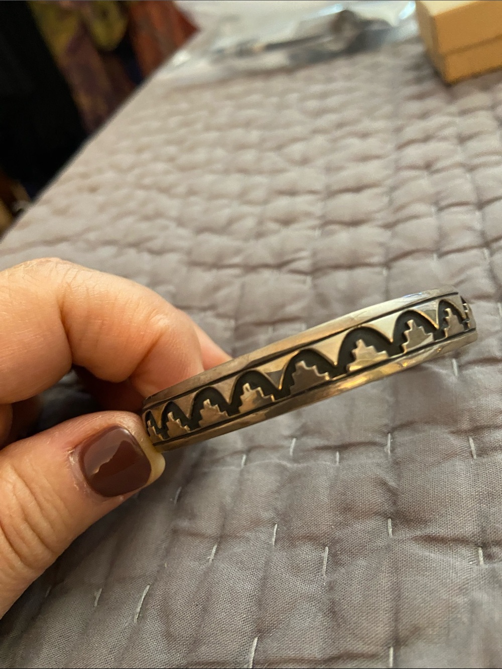 Silver bangle with design